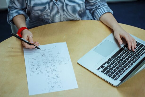 Student answering an AI-generated question on paper beside a laptop