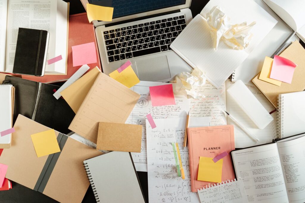 Messy handwritten notes transformed into a clean Cornell-style layout on a laptop