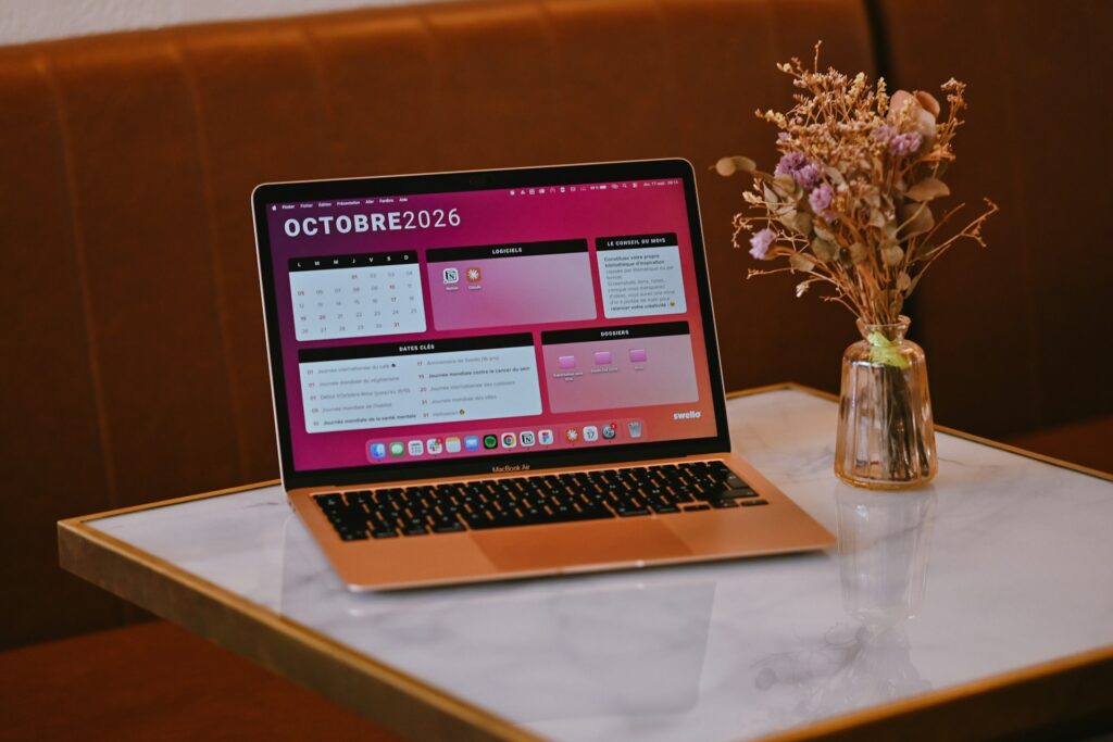 Laptop showing an AI-generated weekly study schedule beside a planner and calendar